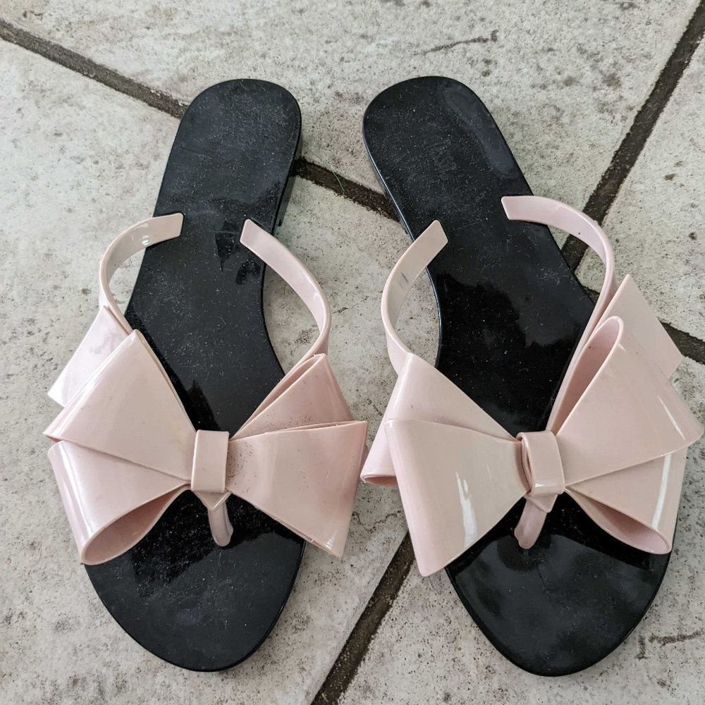 Black Melissa sandals with pink bow on front